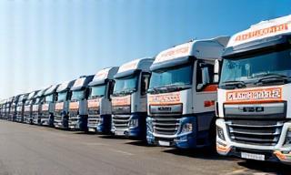 Image of a fleet of Aryan Transport & Logistics trucks